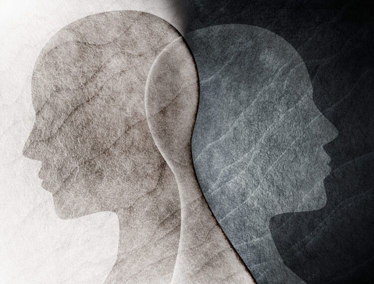 Abstract depiction of two overlapping human profiles representing the complexities of co-occurring mental health and substance use disorders. This image is relevant to Dual Diagnosis Treatment, highlighting the need for integrated care addressing both mental health and addiction issues.