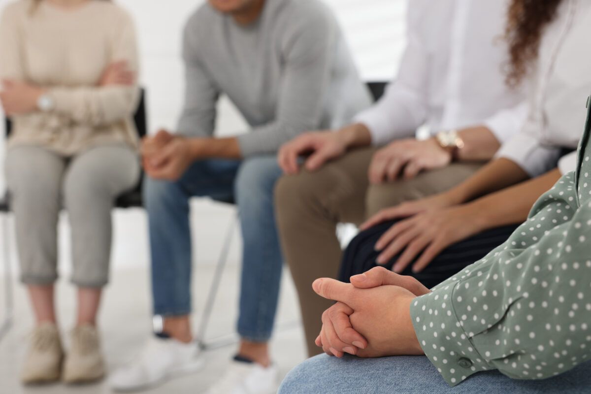 Group therapy session as part of an Aftercare Program, providing ongoing support and guidance for individuals in recovery to maintain long-term sobriety.