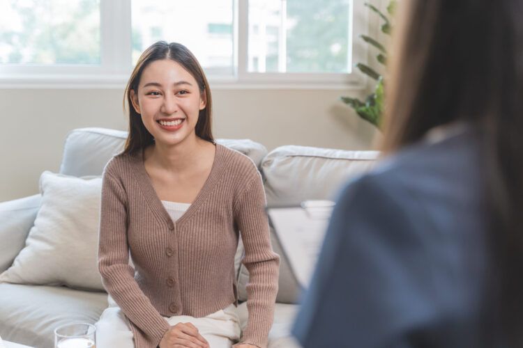 "Smiling woman attending a counseling session at a Substance Abuse Rehab in Tennessee, receiving support for her recovery."