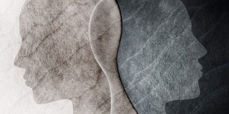 Abstract depiction of two overlapping human profiles representing the complexities of co-occurring mental health and substance use disorders. This image is relevant to Dual Diagnosis Treatment, highlighting the need for integrated care addressing both mental health and addiction issues.