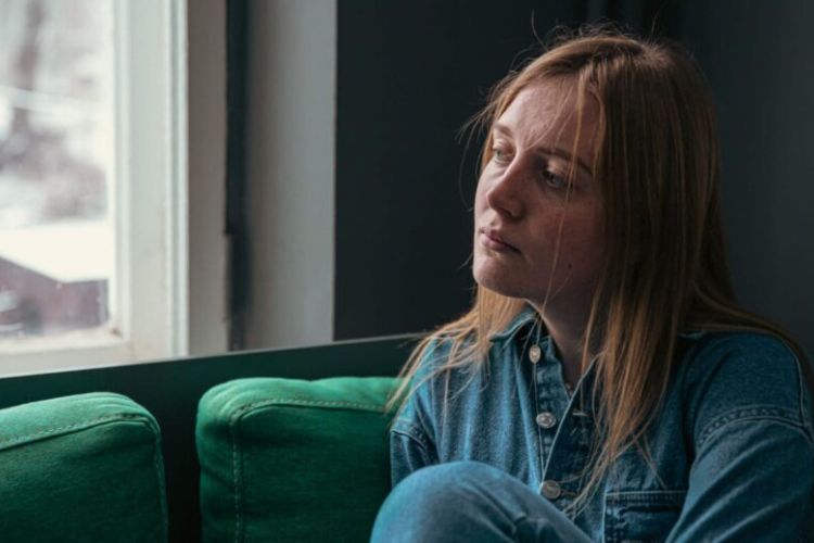 Person experiencing mood changes and fatigue from heroin abuse