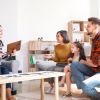 Family sitting together with a therapist during a Family Therapy session, focused on rebuilding relationships and improving communication.