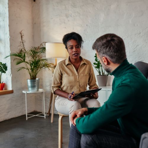 Two individuals celebrating progress in recovery, symbolizing support and success during Opioid Detox in Nashville.