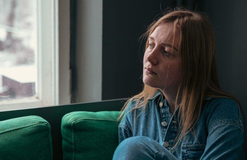 Person experiencing mood changes and fatigue from heroin abuse