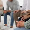 Group therapy session as part of an Aftercare Program, providing ongoing support and guidance for individuals in recovery to maintain long-term sobriety.