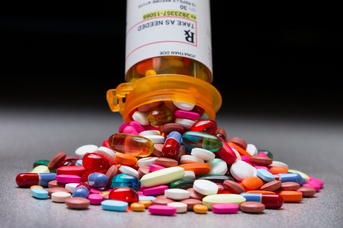Prescription Drug Rehab in Tennessee: A spilled bottle of colorful prescription pills, symbolizing the need for rehabilitation and recovery from prescription drug addiction.