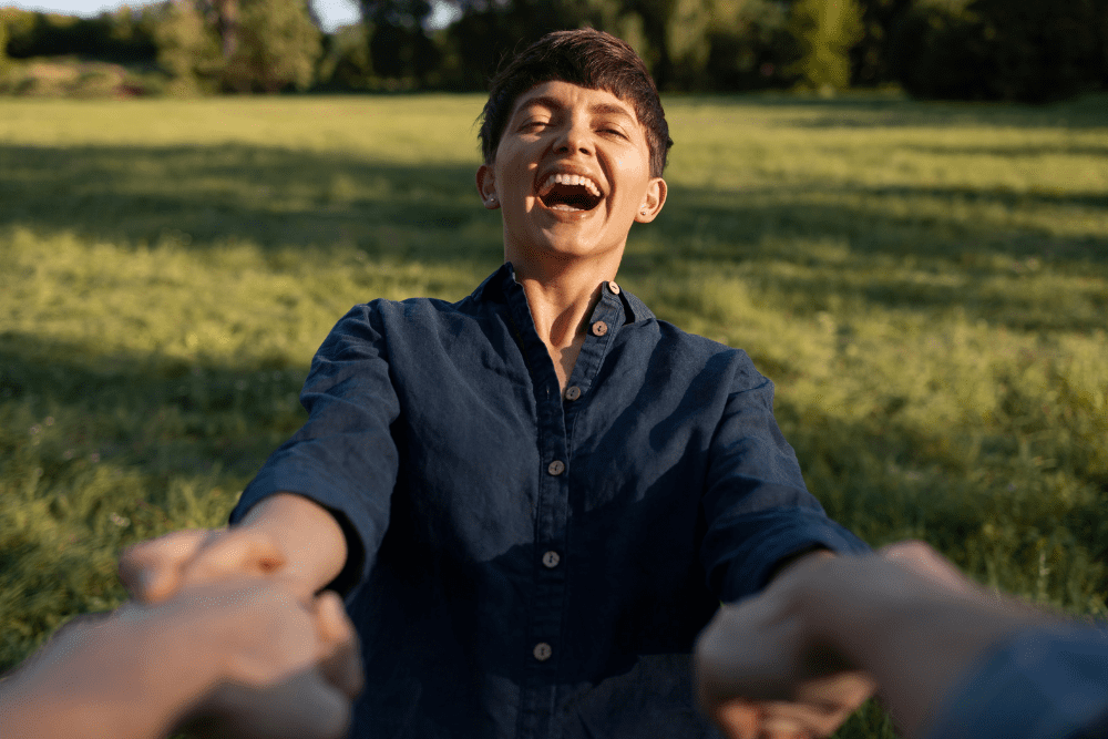 A joyful individual embracing recovery through effective heroin detox in Nashville, enjoying a fresh start outdoors.