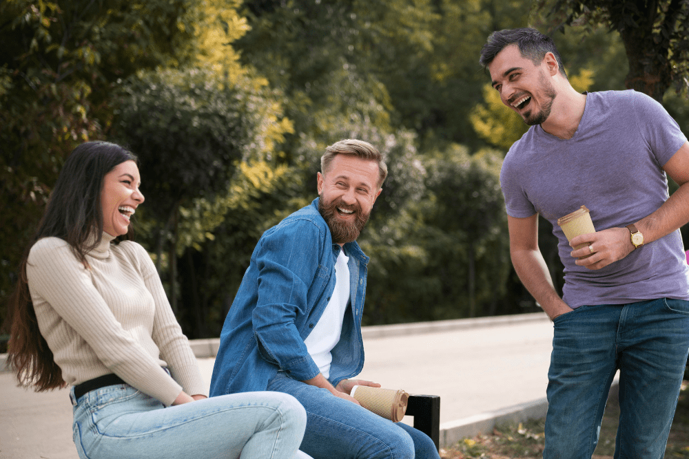 Group of friends laughing outdoors, highlighting the importance of support during cocaine addiction and detox in Nashville.