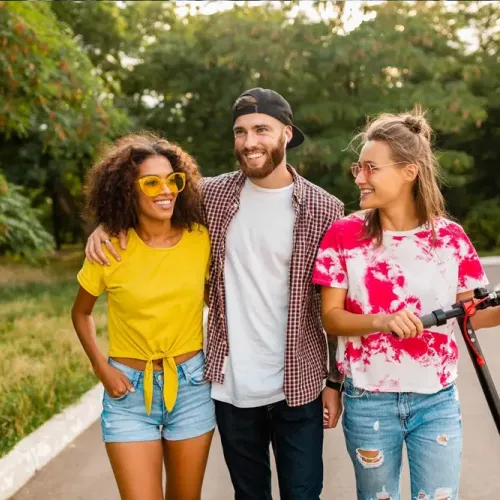 Group of friends walking and smiling together, symbolizing the support and success gained through Alcohol Detox in Tennessee programs