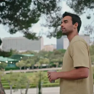 Man standing thoughtfully in a park, showcasing the journey of recovery through Alcohol Detox in Tennessee for a healthier future.